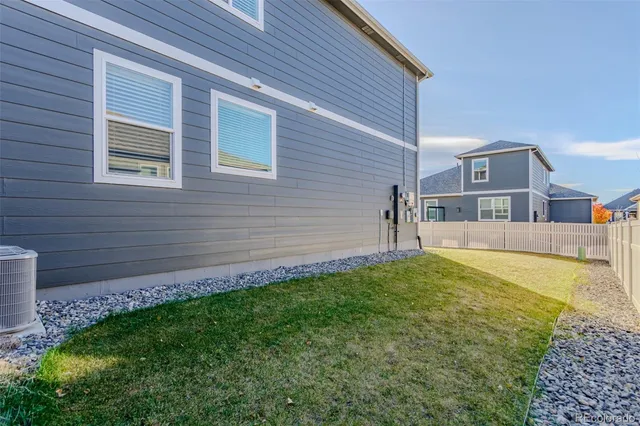 a front view of a house with a yard and a garage