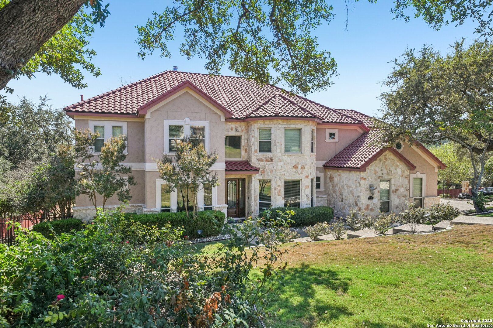 718 Ruidosa Downs Helotes, TX 78023 - Photo 3 of 50 a front view of a house with a yard