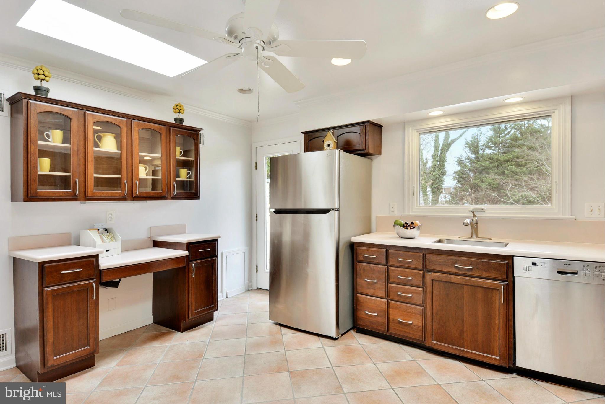 10021 Raynor Road Silver Spring, MD 20901 - Photo 11 of 30 a kitchen with a sink refrigerator and window