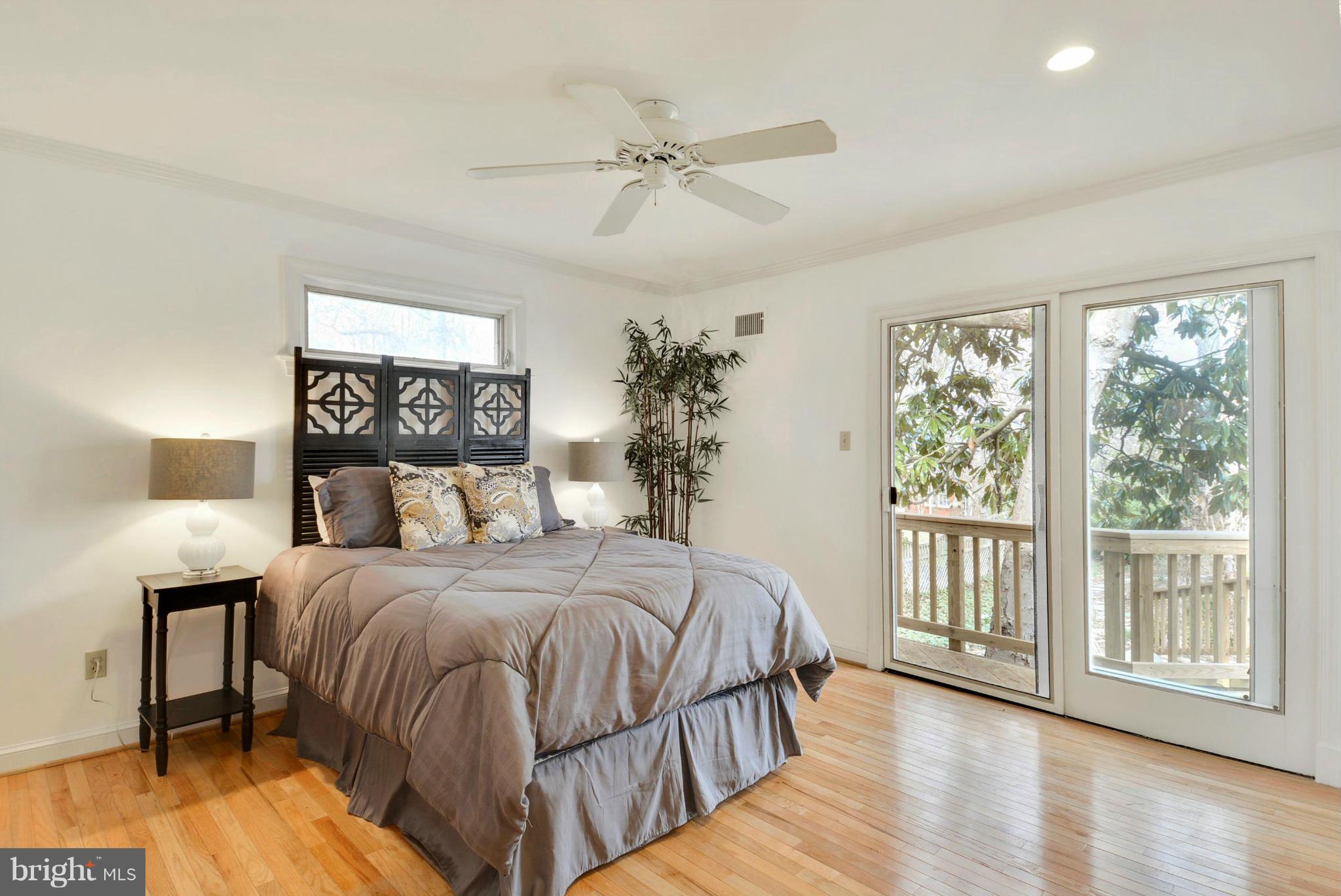 10021 Raynor Road Silver Spring, MD 20901 - Photo 13 of 30 a bedroom with a large bed and a window