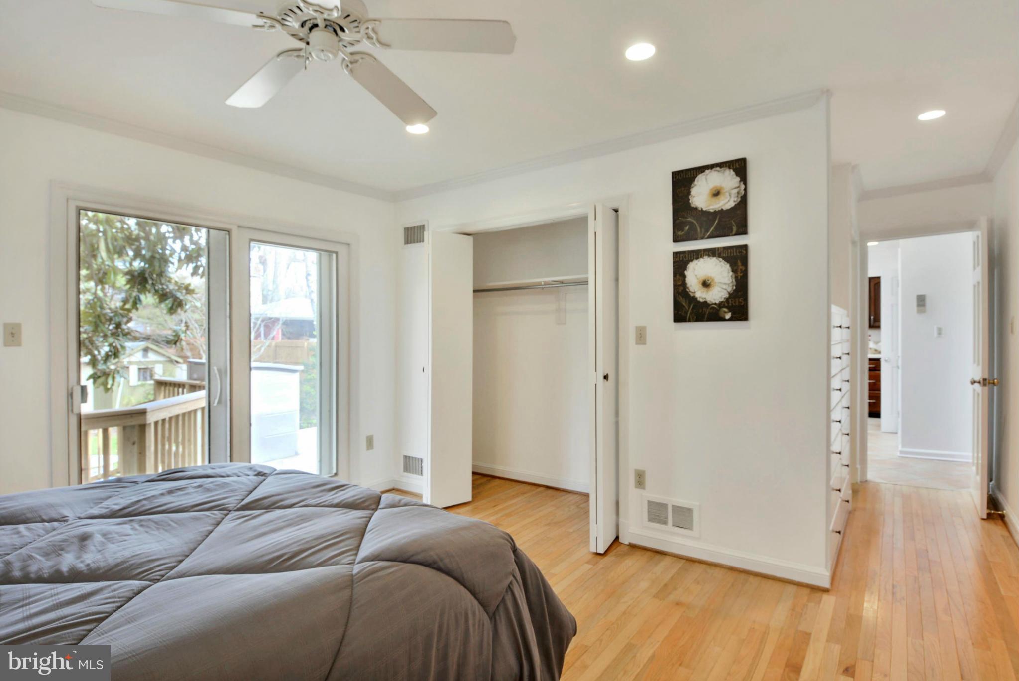10021 Raynor Road Silver Spring, MD 20901 - Photo 14 of 30 a bed room with a bed and a window