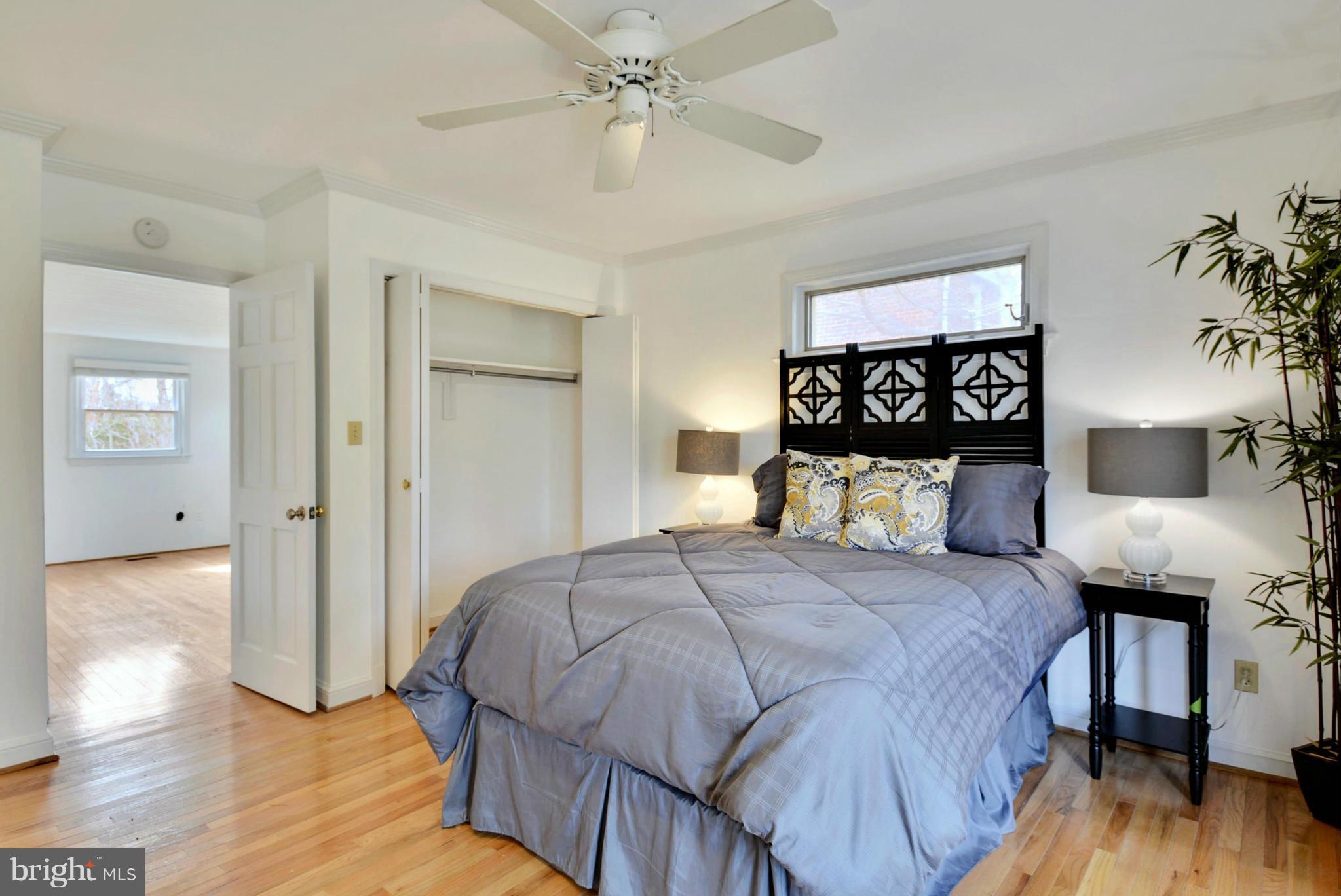 10021 Raynor Road Silver Spring, MD 20901 - Photo 15 of 30 a bedroom with a bed and a table