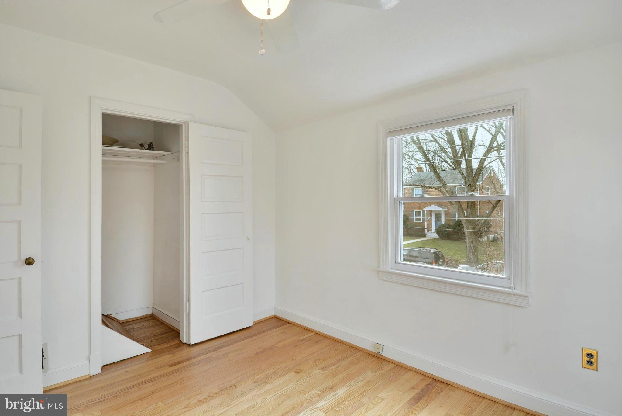 10021 Raynor Road Silver Spring, MD 20901 - Photo 19 of 30 an empty room with wooden floor and windows