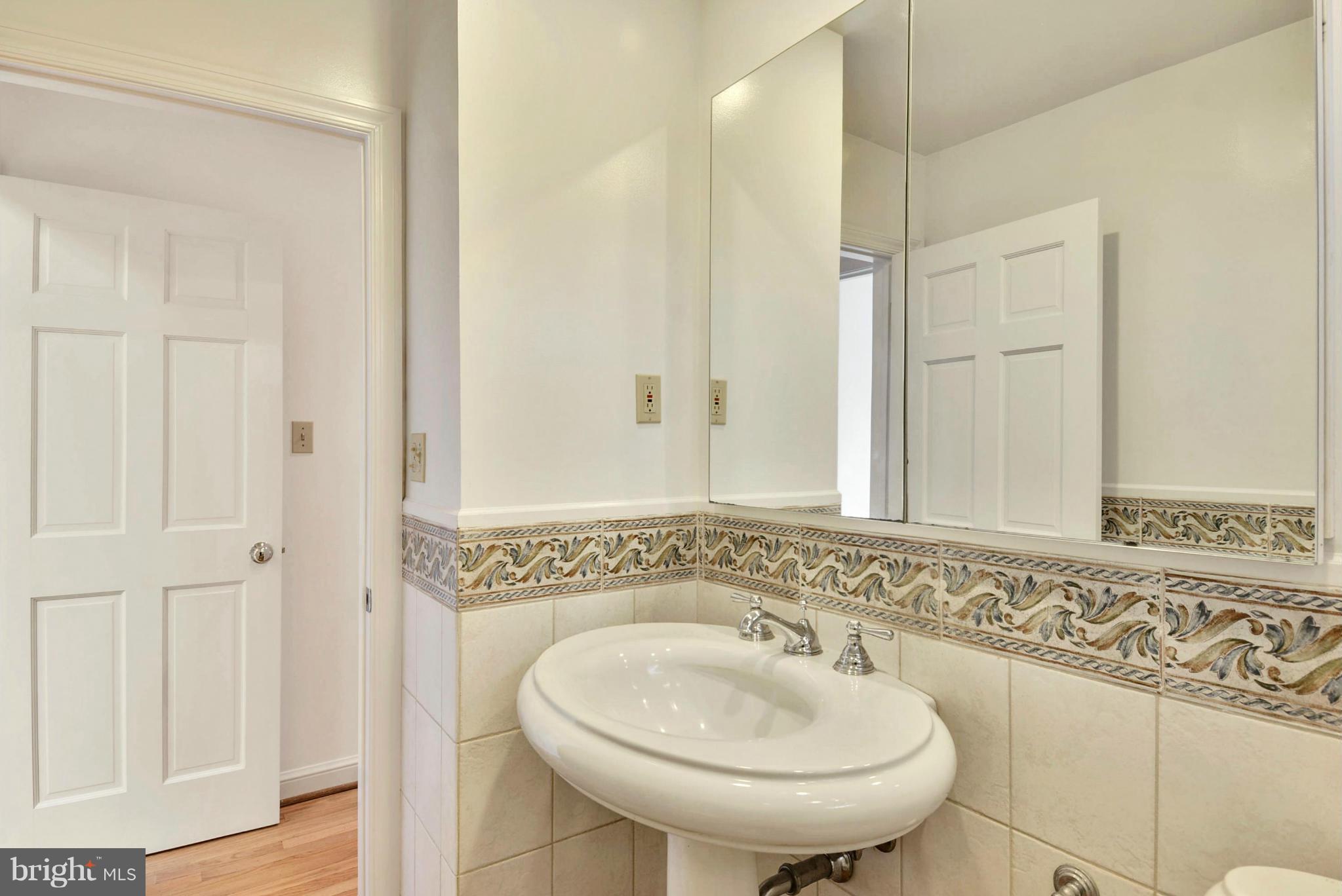 10021 Raynor Road Silver Spring, MD 20901 - Photo 21 of 30 a bathroom with a sink and a mirror