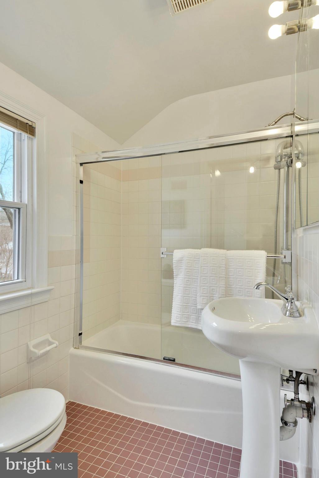 10021 Raynor Road Silver Spring, MD 20901 - Photo 22 of 30 a bathroom with a sink and a mirror