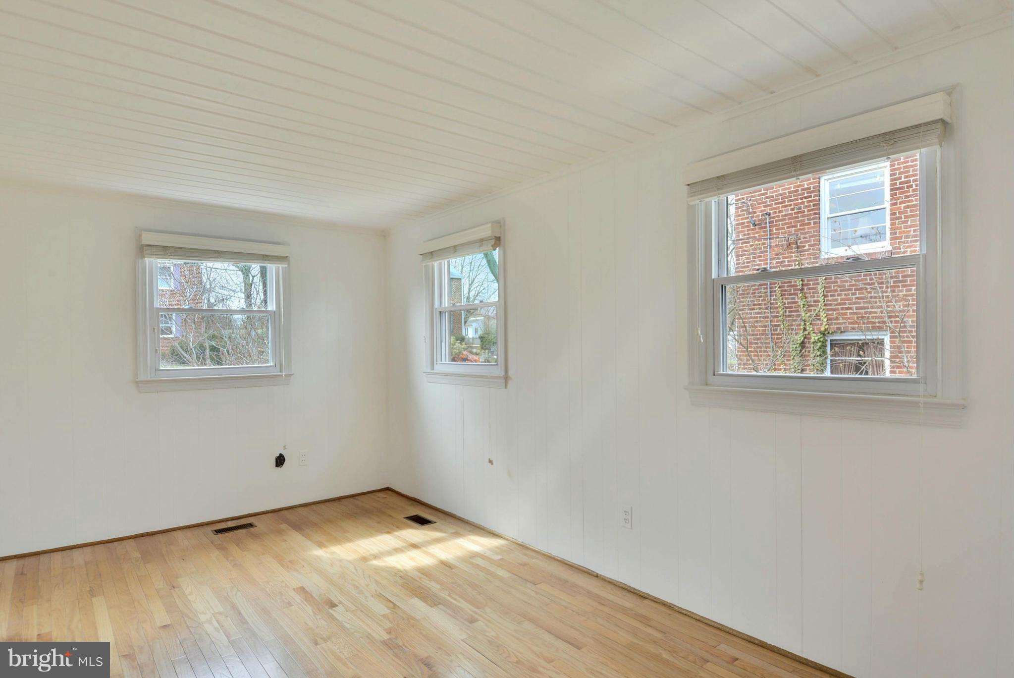10021 Raynor Road Silver Spring, MD 20901 - Photo 26 of 30 a view of empty room with wooden floor and fan