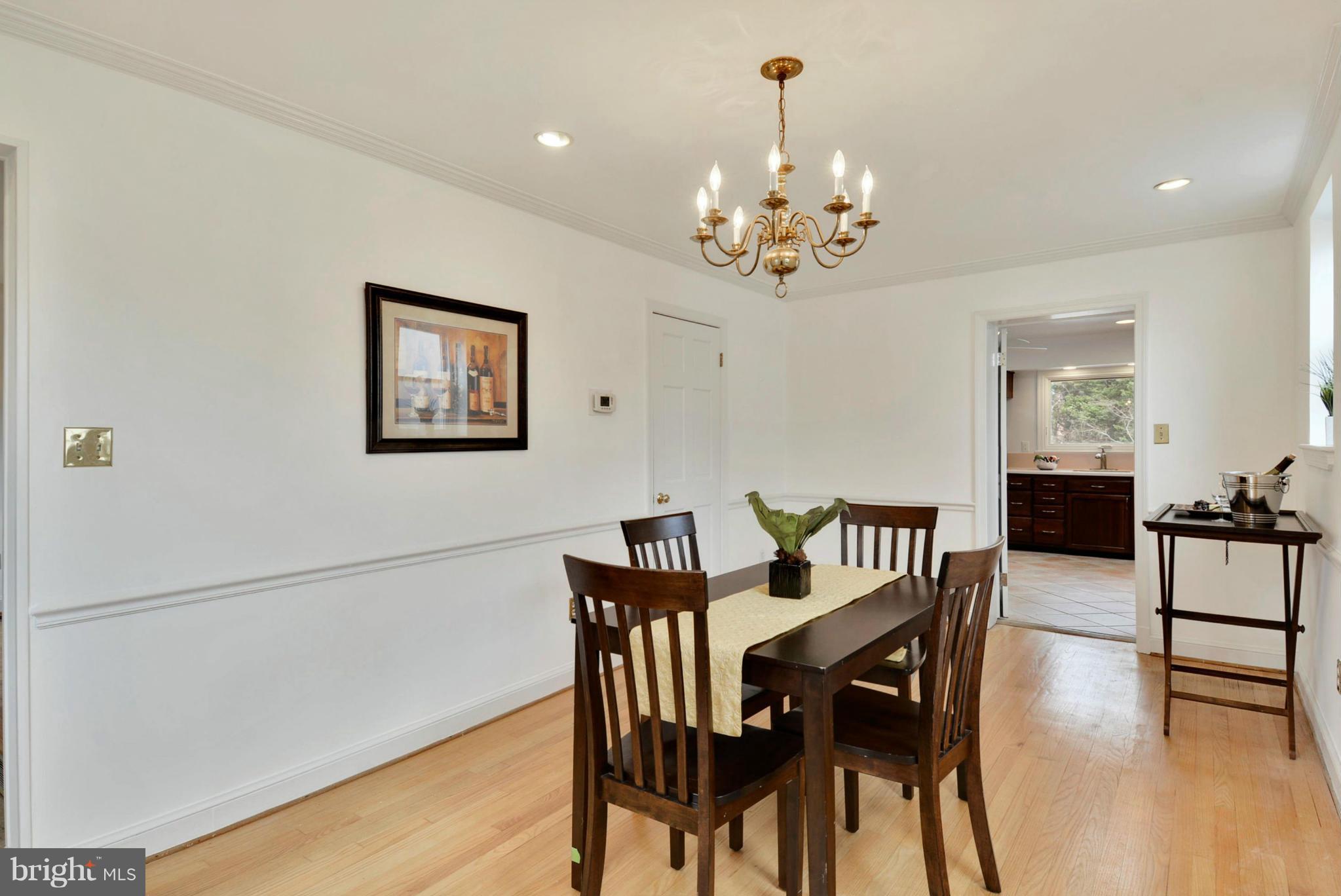 10021 Raynor Road Silver Spring, MD 20901 - Photo 9 of 30 a view of a dining room with furniture and wooden floor