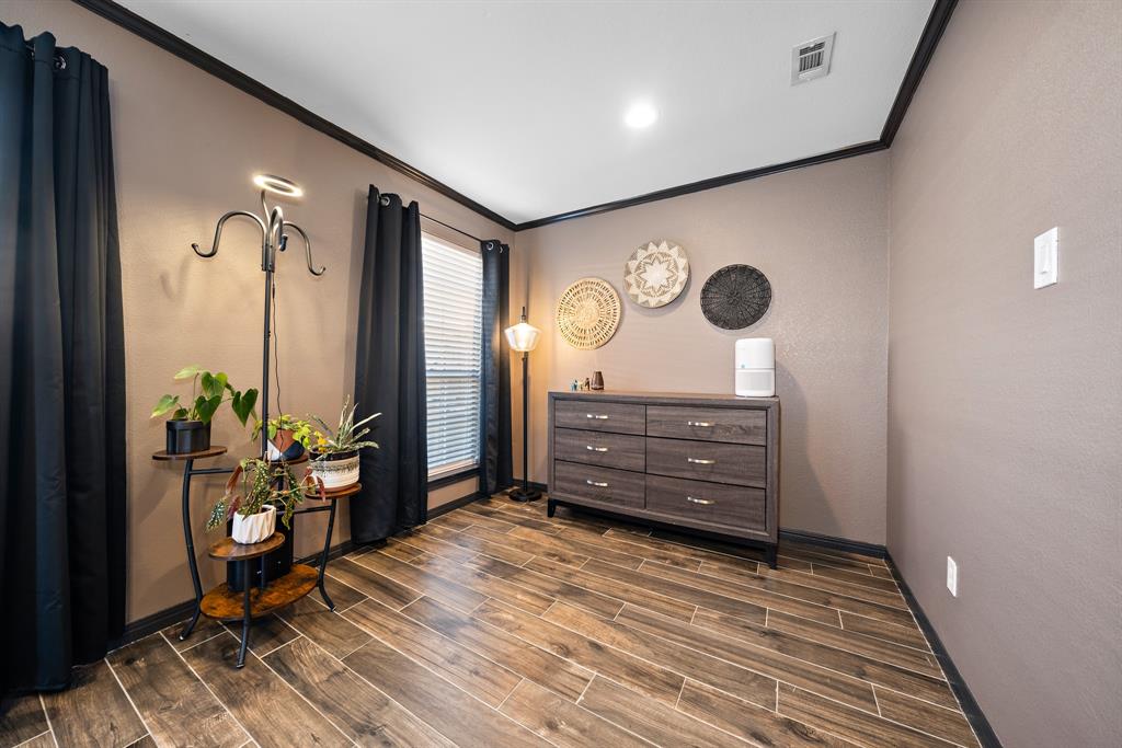 10512 Whitney Trace Drive Waco, TX 76708 - Photo 10 of 36 a room with furniture and wooden floor