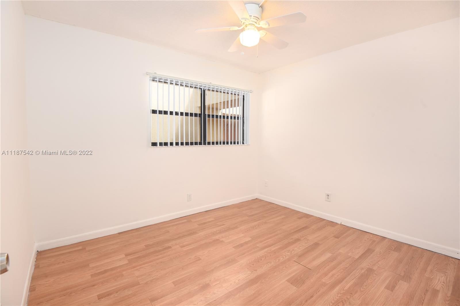 3199 Foxcroft Road, Unit 304 Miramar, FL 33025 - Photo 12 of 35 an empty room with a window