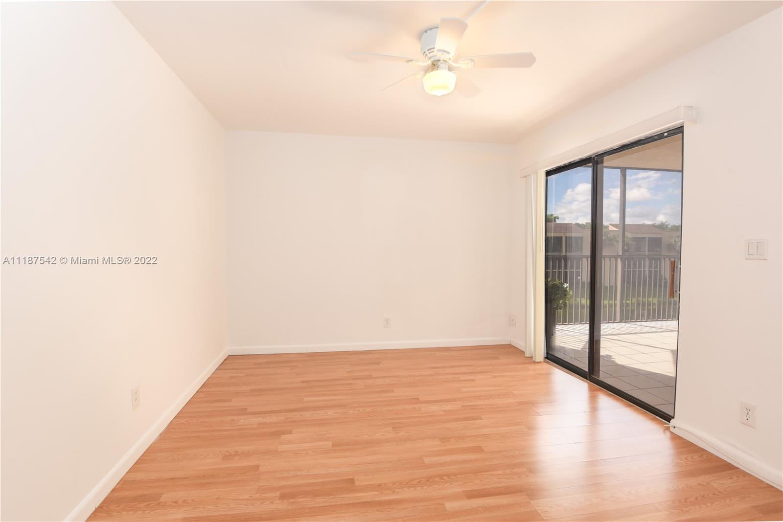 3199 Foxcroft Road, Unit 304 Miramar, FL 33025 - Photo 18 of 35 a view of empty room with wooden floor