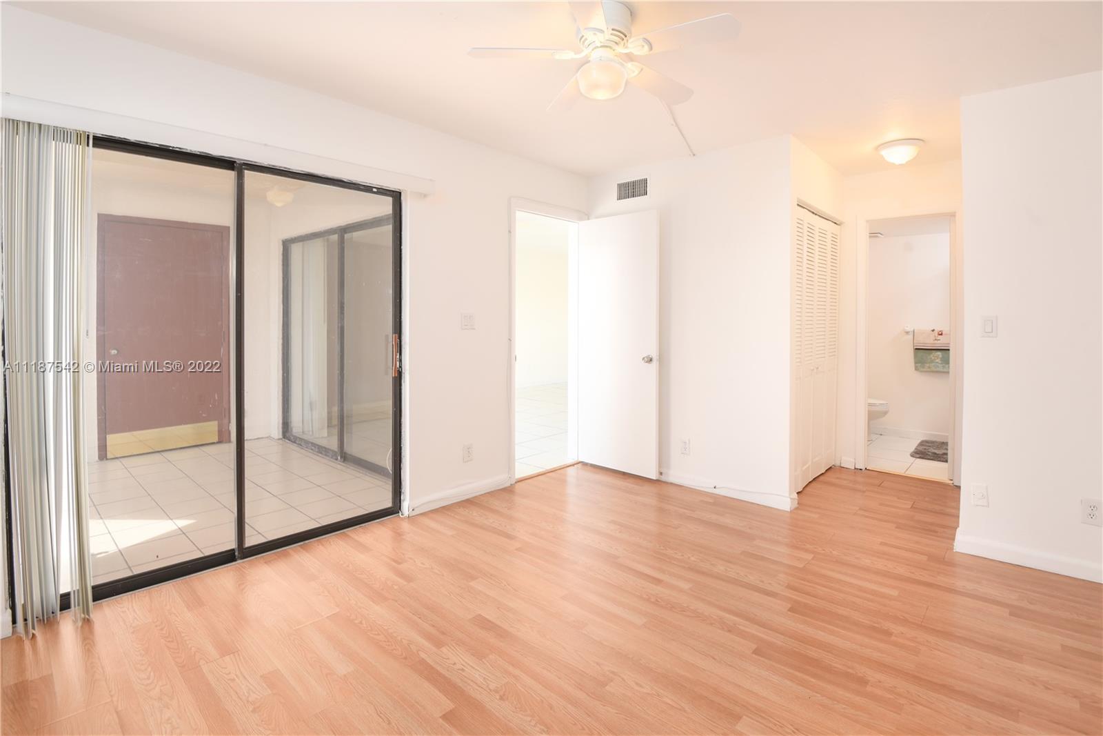 3199 Foxcroft Road, Unit 304 Miramar, FL 33025 - Photo 19 of 35 a view of an empty room with wooden floor