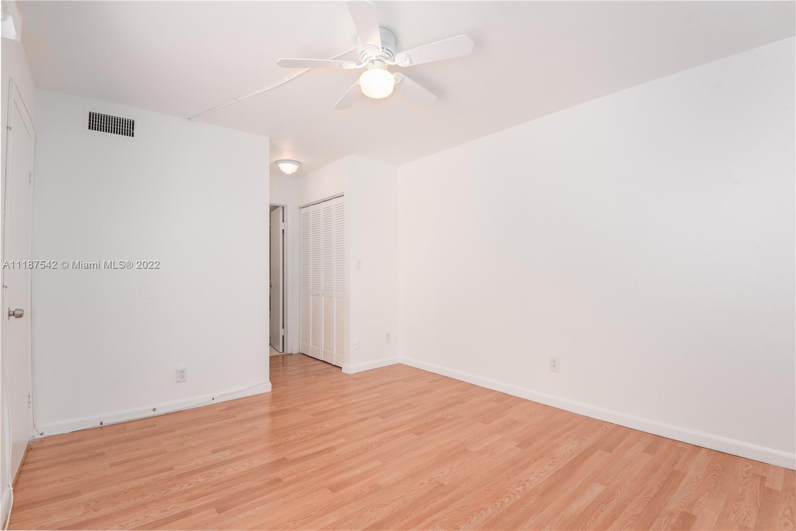 3199 Foxcroft Road, Unit 304 Miramar, FL 33025 - Photo 20 of 35 a view of empty room with wooden floor