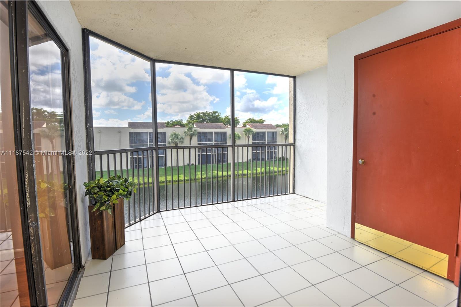 3199 Foxcroft Road, Unit 304 Miramar, FL 33025 - Photo 22 of 35 a view of a large window with an outdoor space