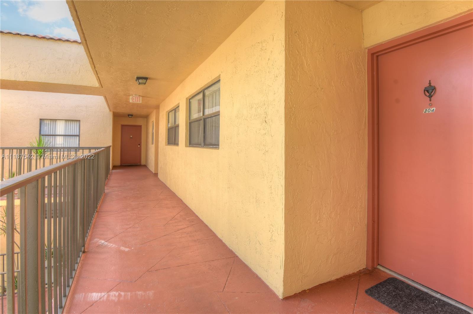 3199 Foxcroft Road, Unit 304 Miramar, FL 33025 - Photo 27 of 35 a view of a house with wooden fence