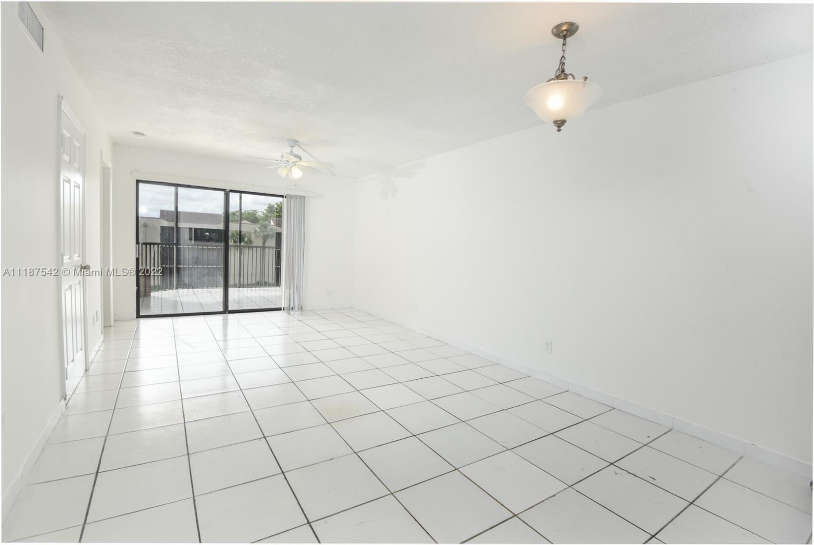 3199 Foxcroft Road, Unit 304 Miramar, FL 33025 - Photo 8 of 35 a view of an empty room and window