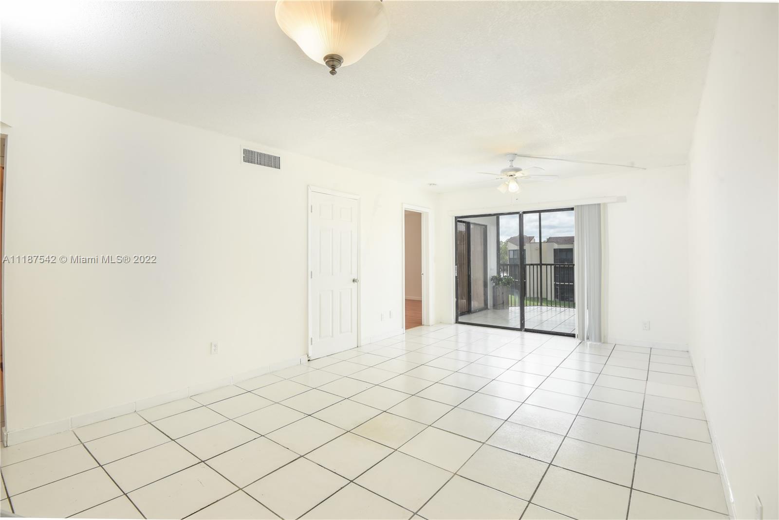3199 Foxcroft Road, Unit 304 Miramar, FL 33025 - Photo 9 of 35 a view of an empty room and window