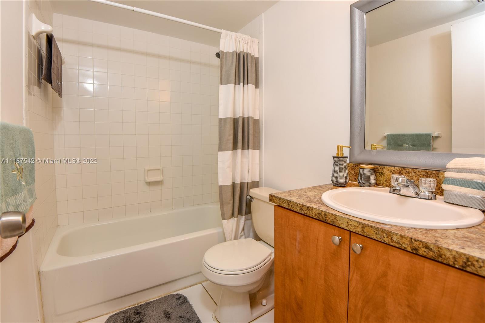3199 Foxcroft Road, Unit 304 Miramar, FL 33025 - Photo 10 of 35 a bathroom with a sink toilet and shower