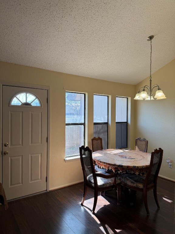16023 Stoneham Circle Pflugerville, TX 78660 - Photo 8 of 13 a view of a dining room with furniture window and wooden floor