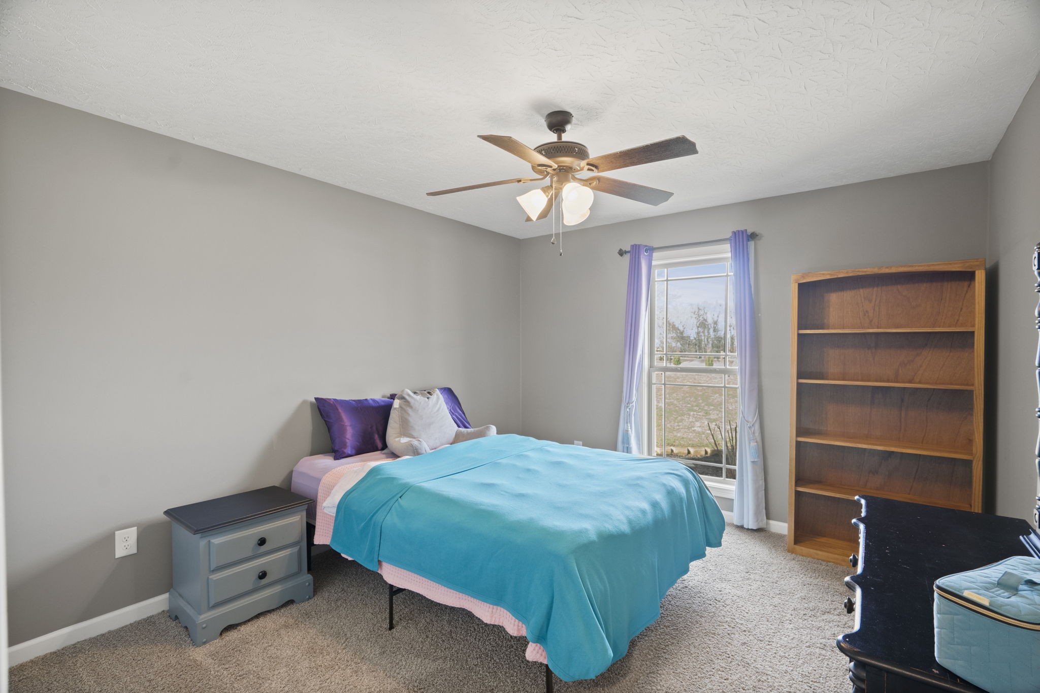 8930 New Chapel Road Springfield, TN 37172 - Photo 25 of 57 a bedroom with a bed and a chandelier
