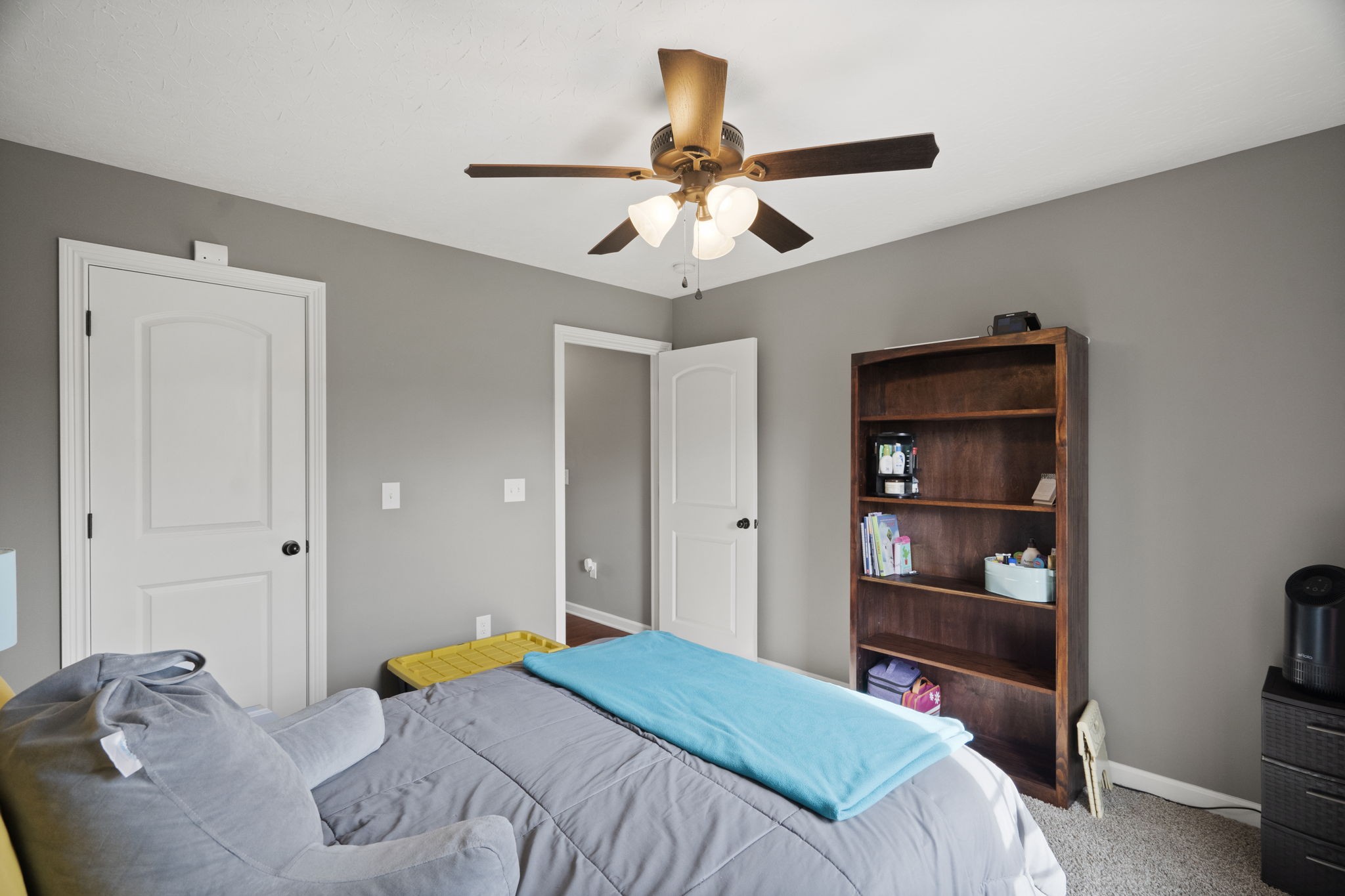8930 New Chapel Road Springfield, TN 37172 - Photo 29 of 57 a bedroom with a bed and a chandelier