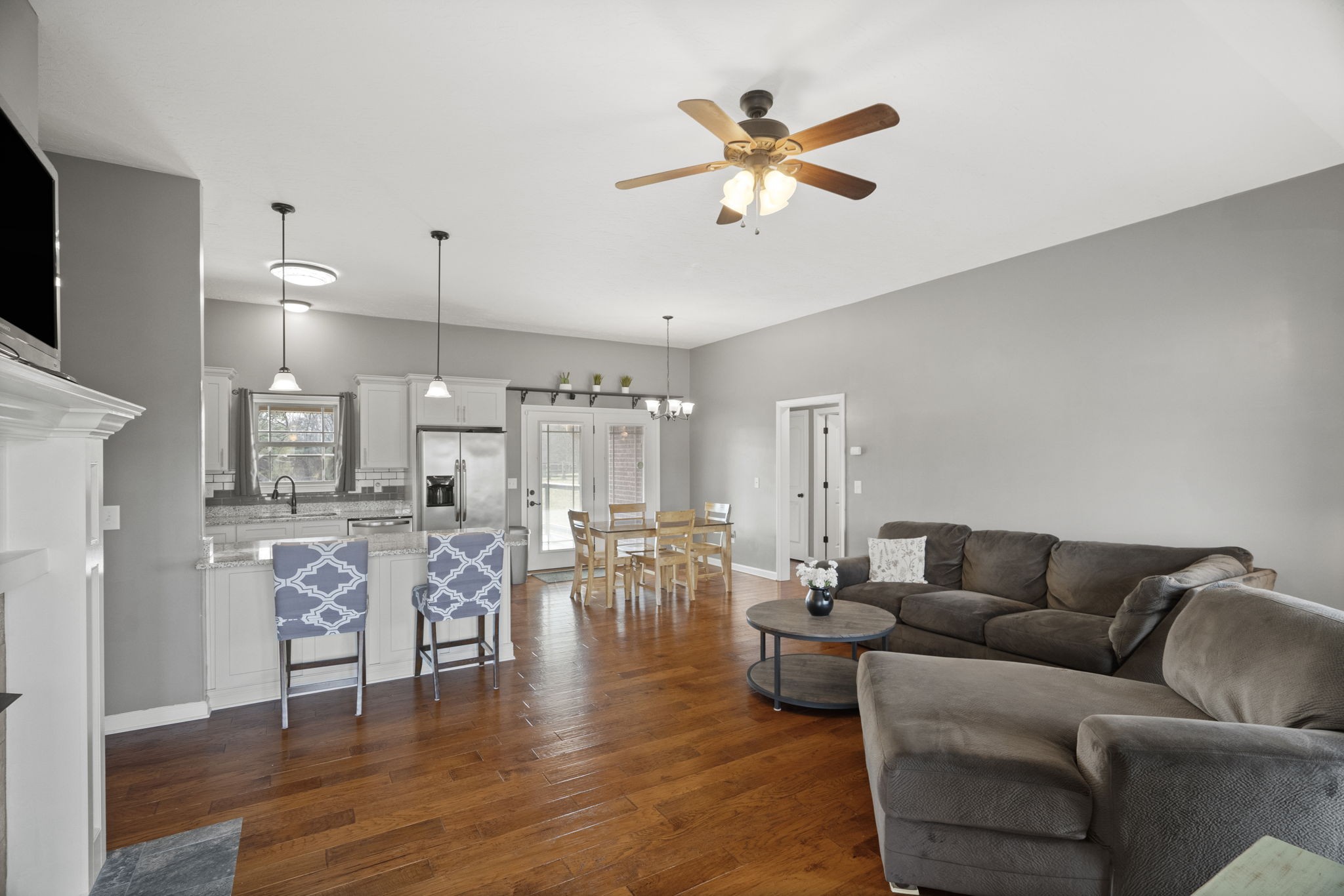 8930 New Chapel Road Springfield, TN 37172 - Photo 7 of 57 a living room with furniture kitchen view and a wooden floor