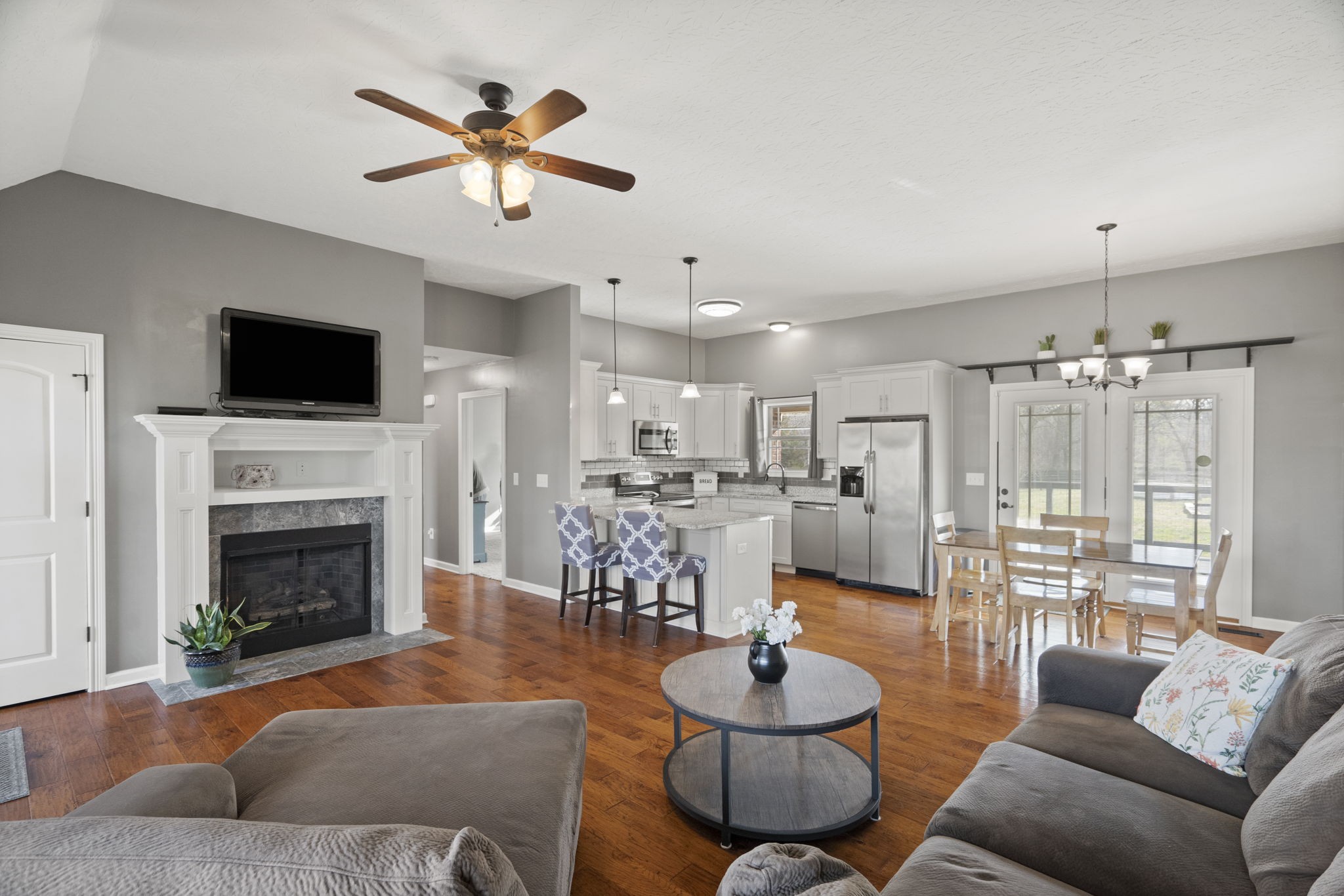 8930 New Chapel Road Springfield, TN 37172 - Photo 10 of 57 a living room with furniture a fireplace and a flat screen tv