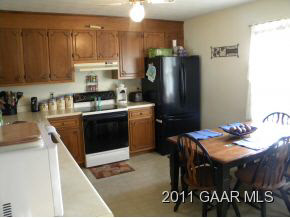 49 Buckboard Road Waynesboro, VA 22980 - Photo 4 of 11 a kitchen with stainless steel appliances granite countertop a refrigerator a sink and a stove