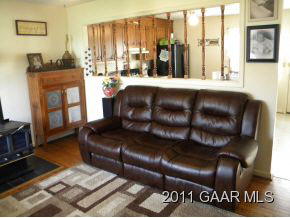 49 Buckboard Road Waynesboro, VA 22980 - Photo 6 of 11 a living room with a couch wooden floor and a window
