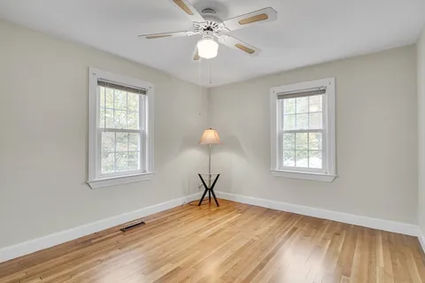 a room with window and wooden floor