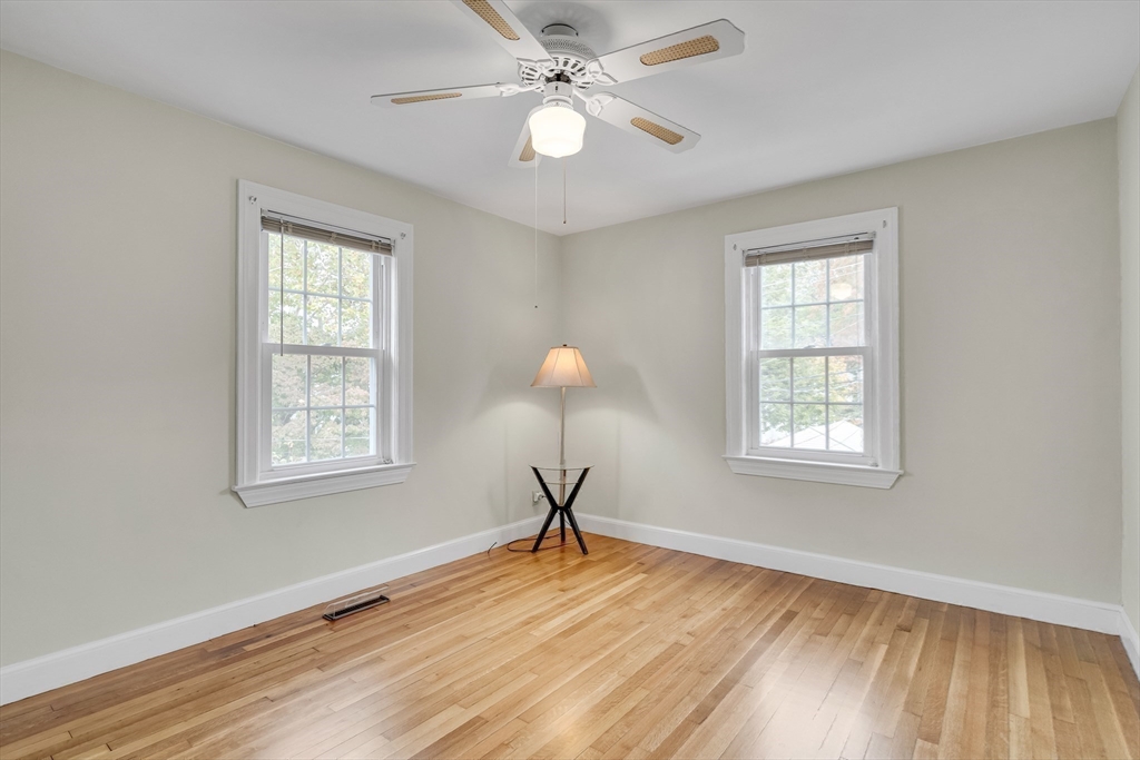 15 Sunset Road Cambridge, MA 02138 - Photo 18 of 26 a room with window and wooden floor