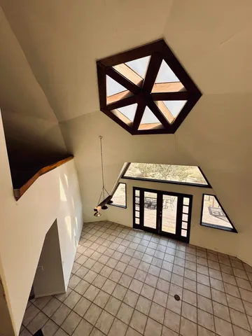 a view of an entryway with a bench