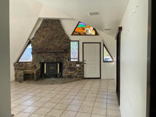 a bathroom with a granite countertop sink and a window