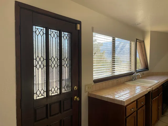 a bathroom with a sink a toilet and mirror