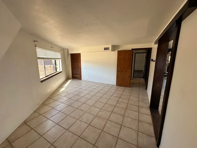 a view of a hallway with a window