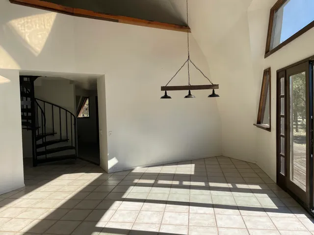a bathroom with a granite countertop sink a toilet and a mirror