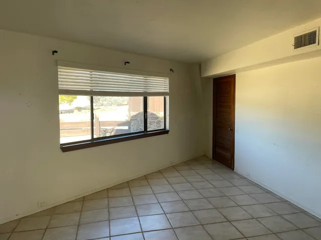 a terrace with outdoor seating and city view