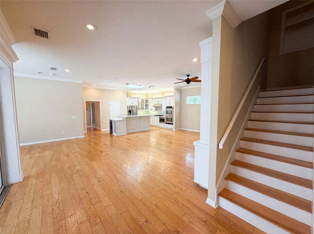 13478 Northwest 9 Road Newberry, FL 32669 - Photo 3 of 31 a view of entryway with wooden floor and stairs