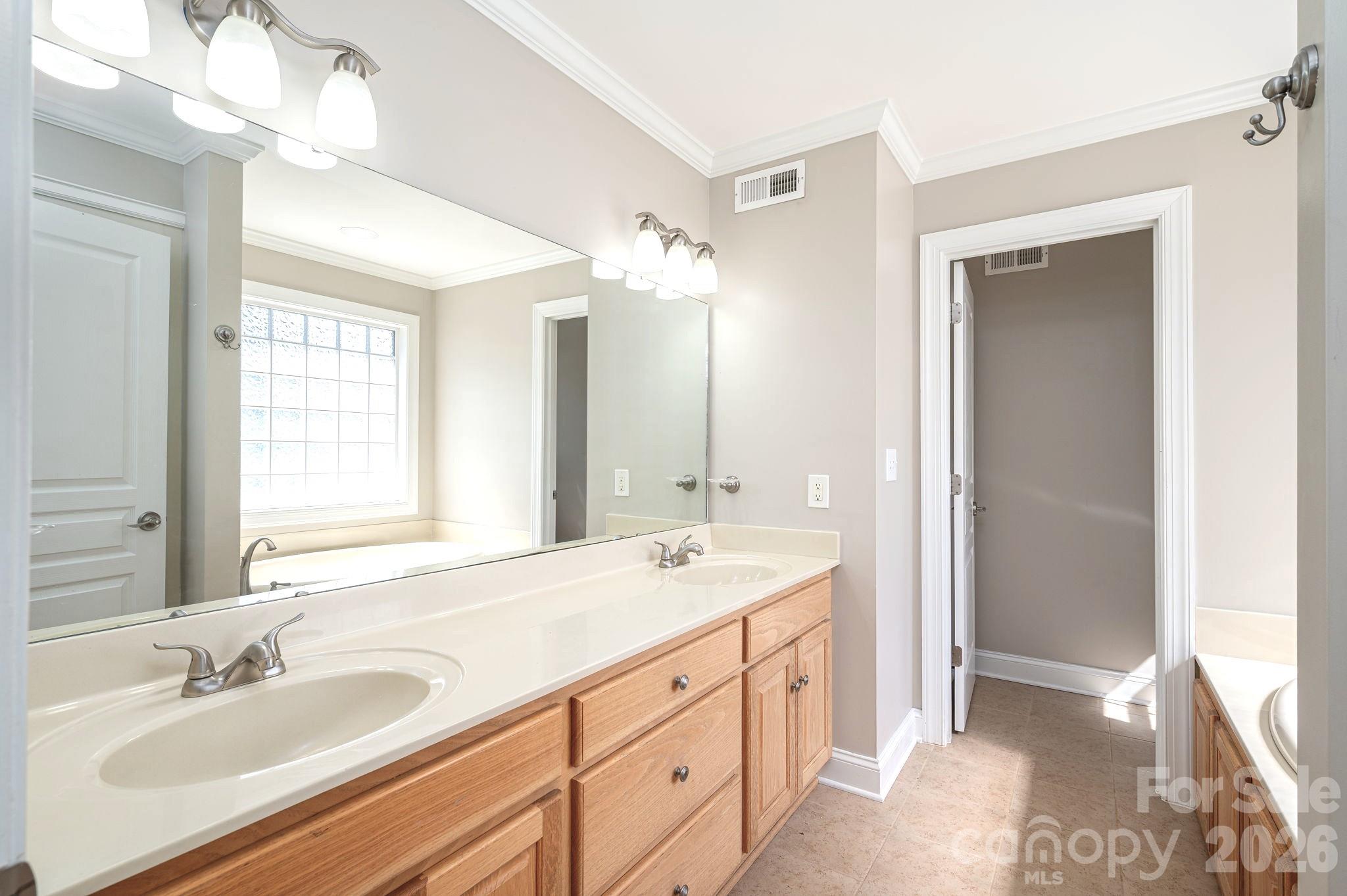 515 Highway 161 Clover, SC 29710 - Photo 15 of 30 a spacious bathroom with a double vanity sink a mirror and a shower