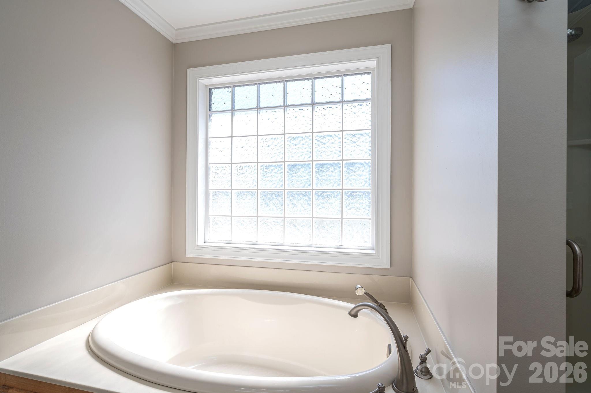 515 Highway 161 Clover, SC 29710 - Photo 16 of 30 a white bath tub sitting in a bathroom next to a window