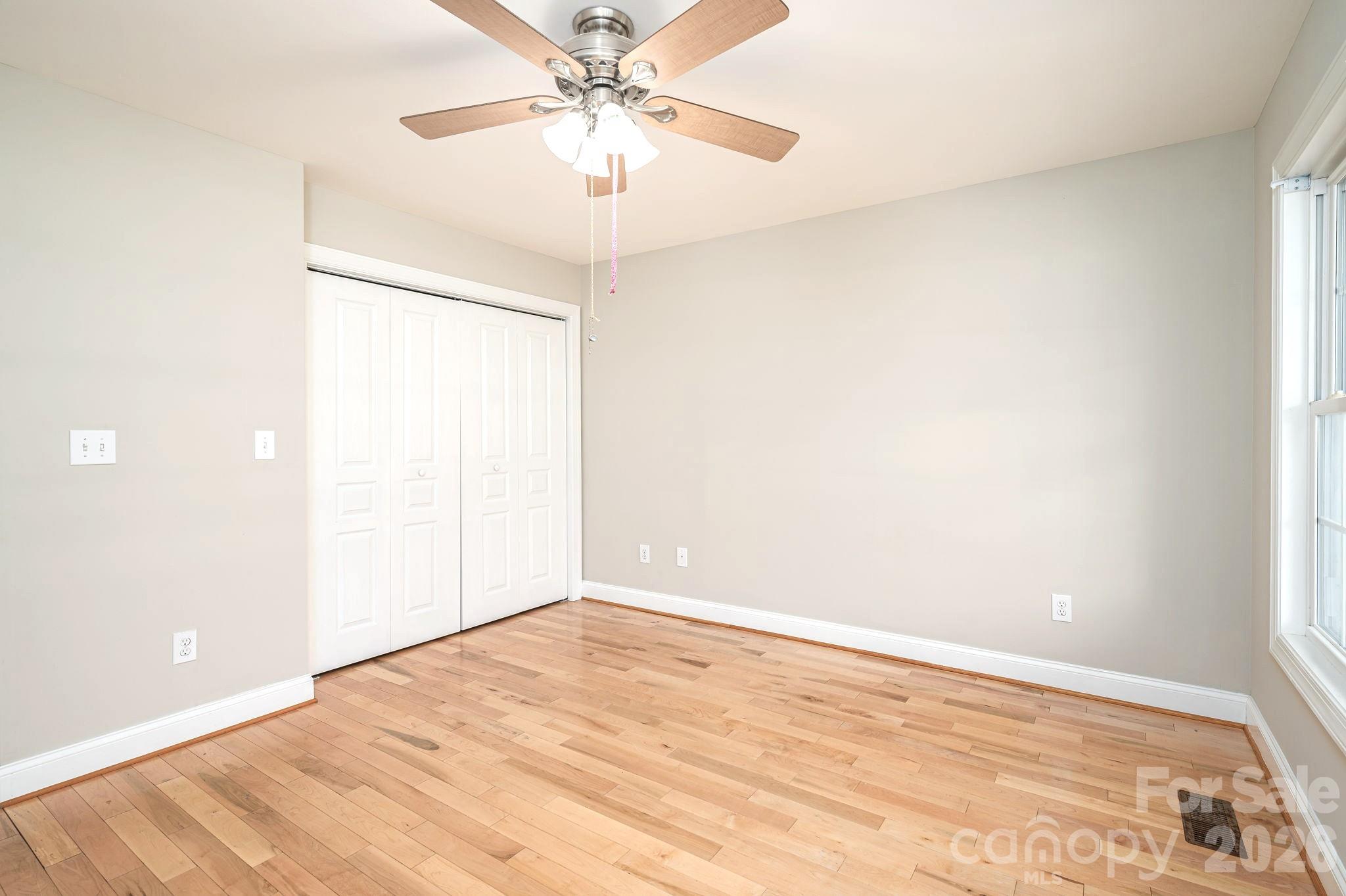 515 Highway 161 Clover, SC 29710 - Photo 19 of 30 an empty room with a fan & a window