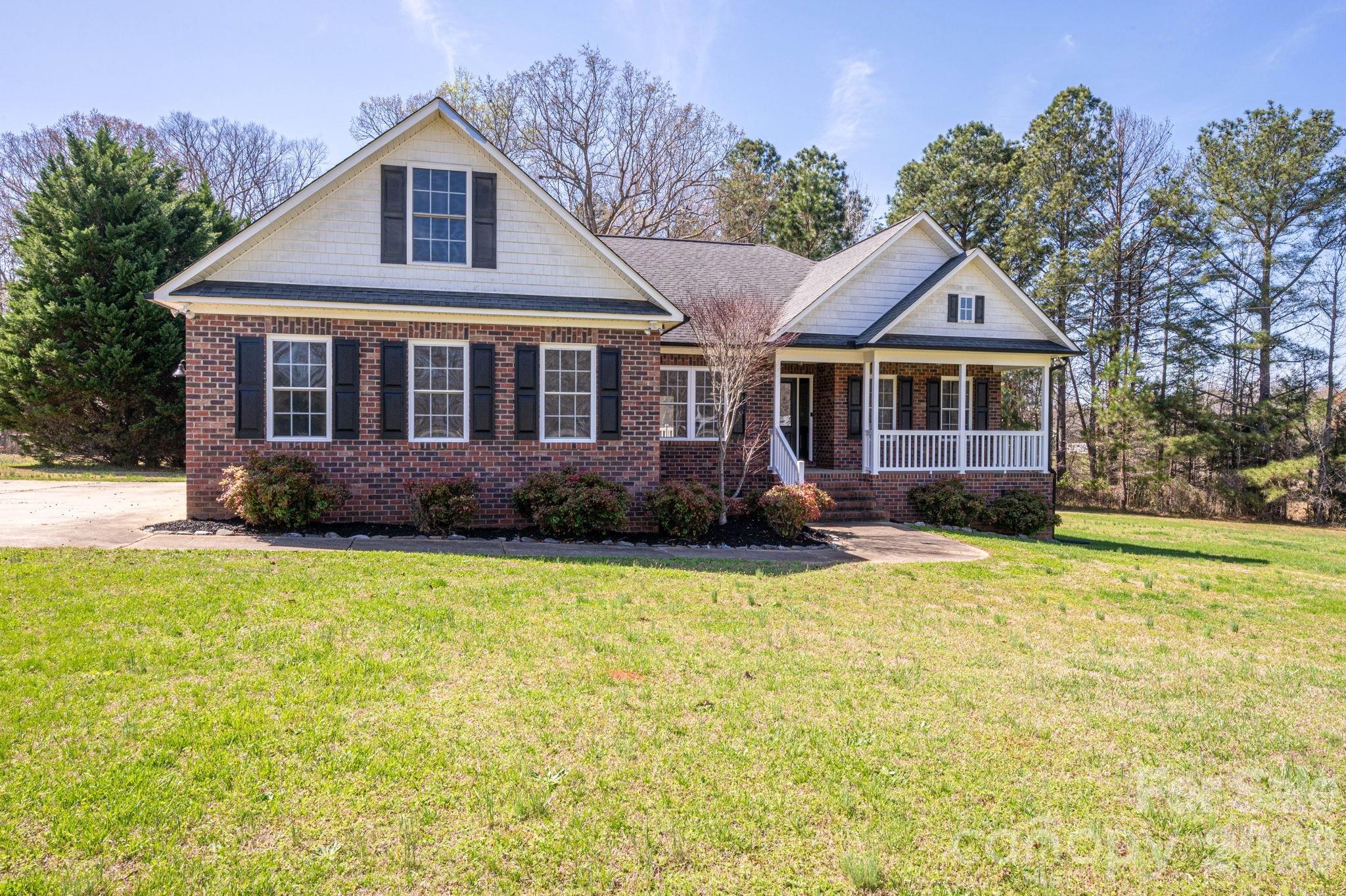 515 Highway 161 Clover, SC 29710 - Photo 2 of 30 a front view of a house with a garden