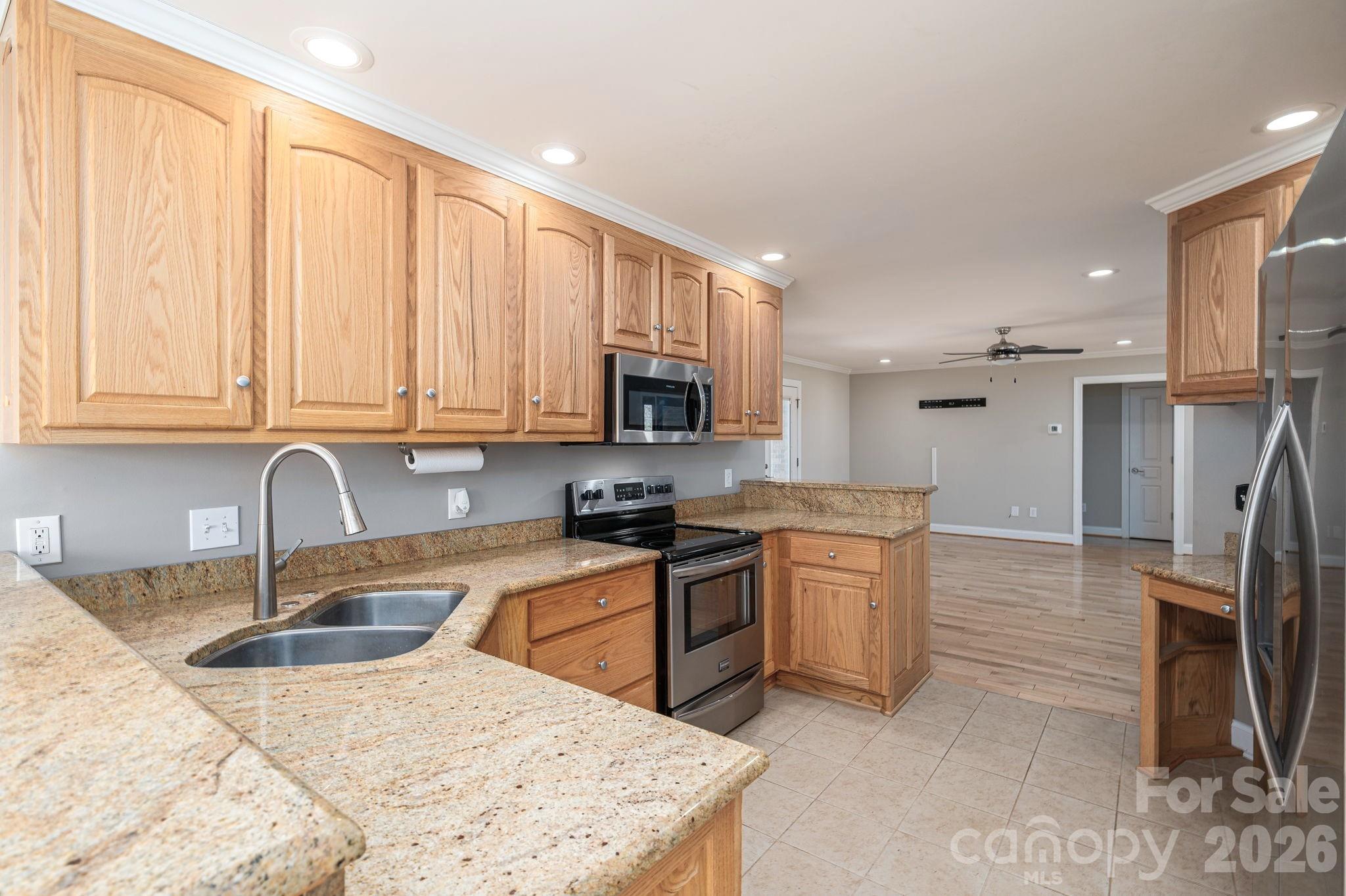 515 Highway 161 Clover, SC 29710 - Photo 8 of 30 a kitchen with stainless steel appliances granite countertop a sink stove and refrigerator