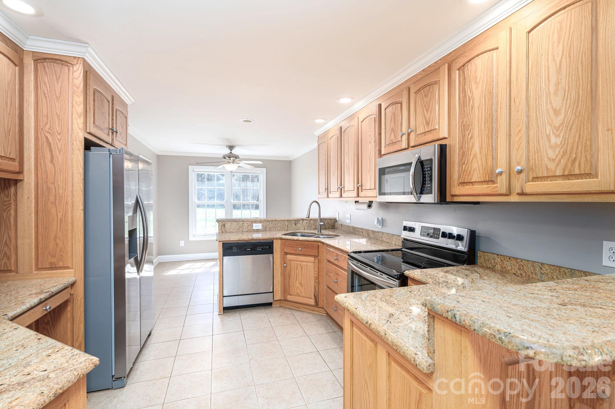 515 Highway 161 Clover, SC 29710 - Photo 10 of 30 a kitchen with stainless steel appliances granite countertop a stove a sink and a microwave