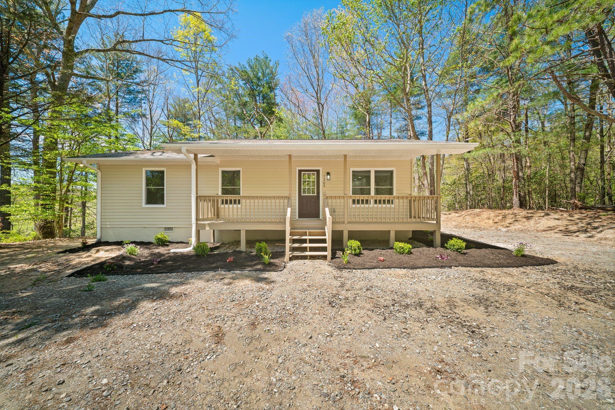 1263 See Off Mountain Road Brevard, NC 28712 - Photo 16 of 21 a view of a house with a backyard