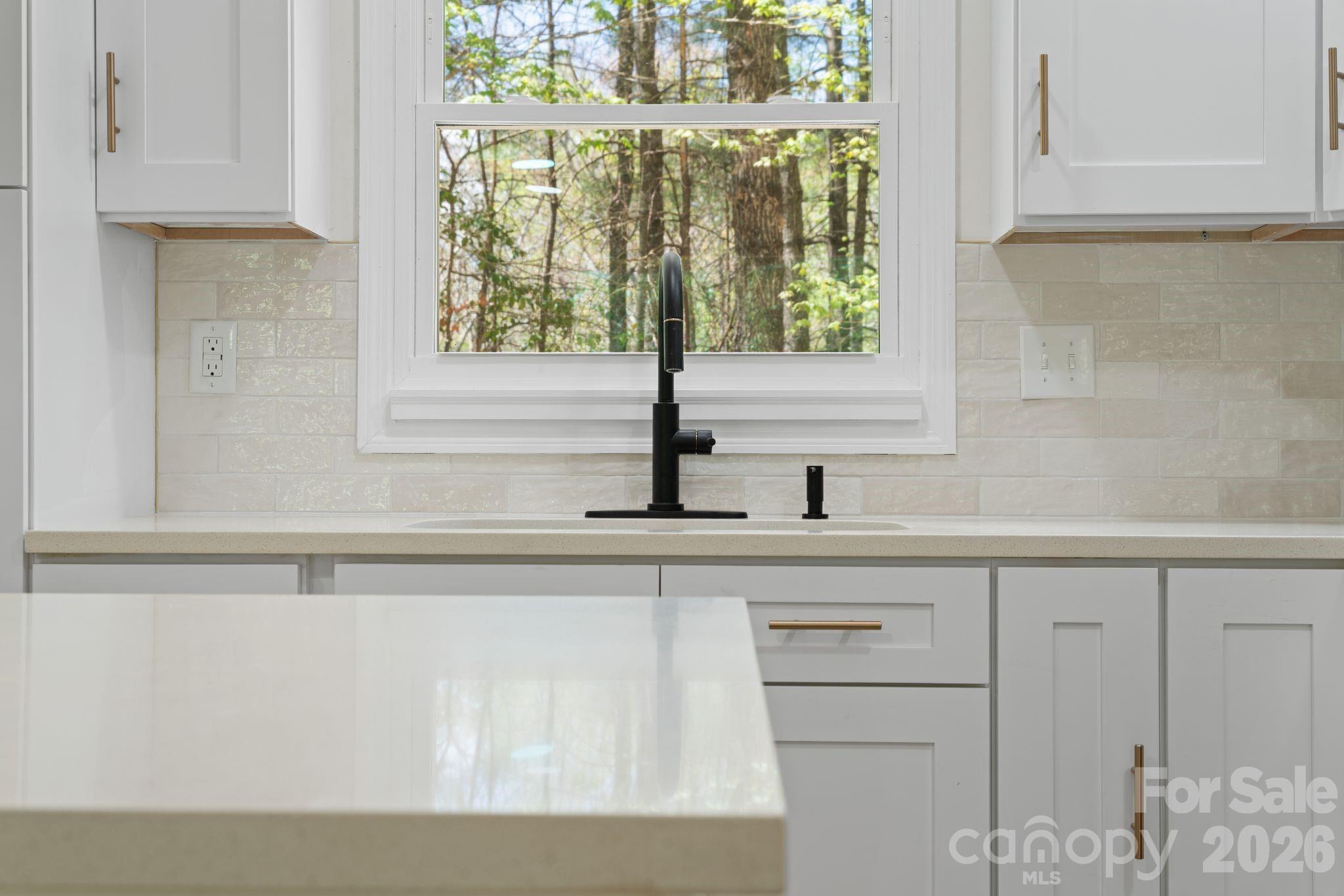 1263 See Off Mountain Road Brevard, NC 28712 - Photo 9 of 21 a kitchen with a sink and cabinets
