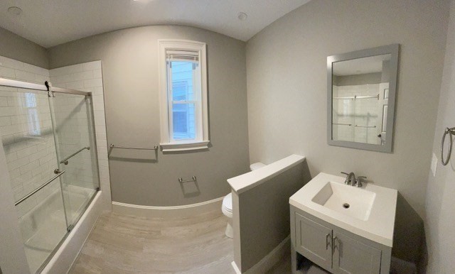 15 Dix Street, Unit 2 Boston, MA 02122 - Photo 12 of 14 a bathroom with a sink a toilet and shower