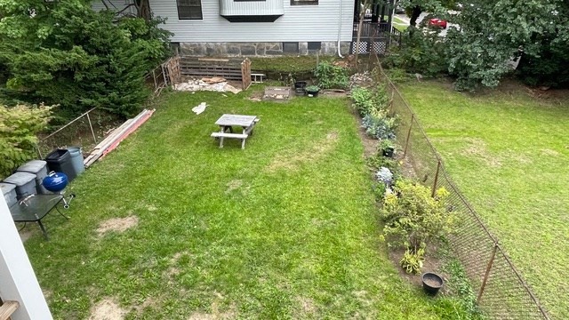 15 Dix Street, Unit 2 Boston, MA 02122 - Photo 14 of 14 a view of a backyard with plants and a patio