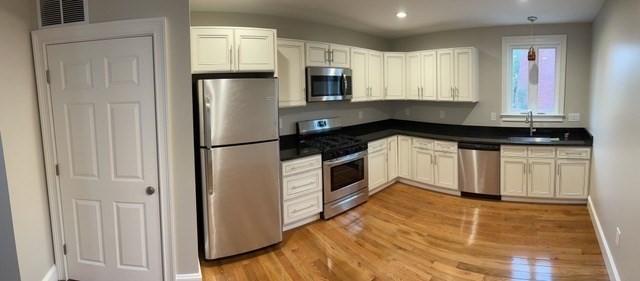15 Dix Street, Unit 2 Boston, MA 02122 - Photo 4 of 14 a kitchen with granite countertop a refrigerator and a sink