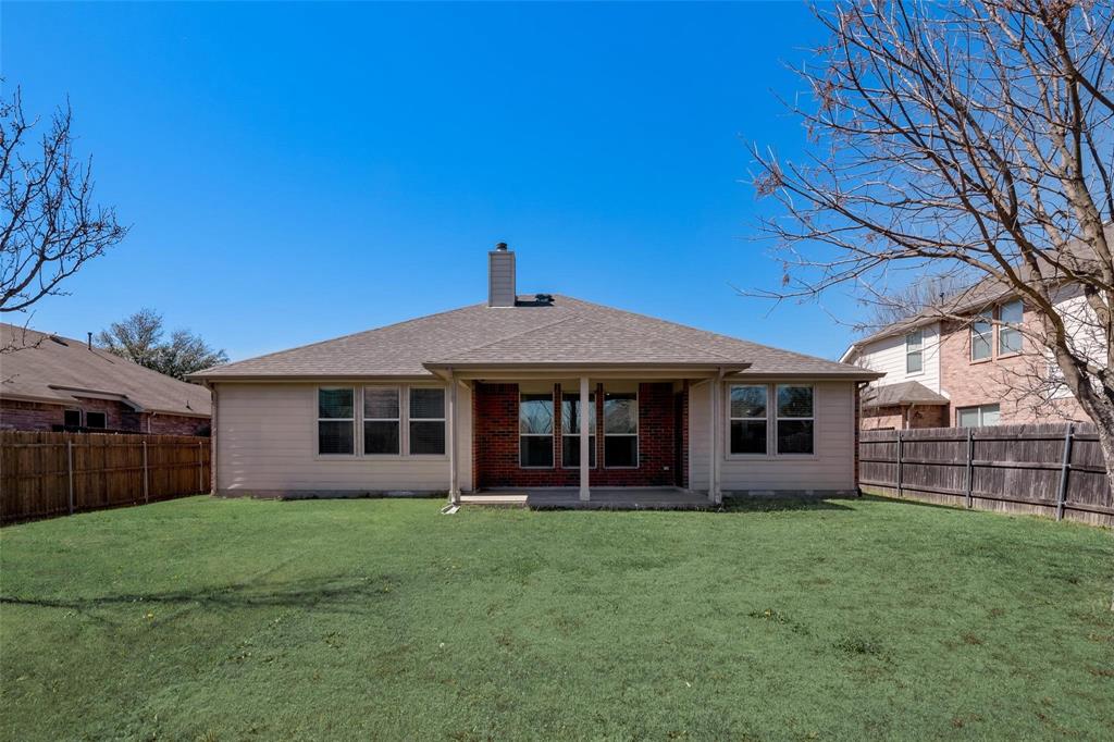 315 Red Oak Court Forney, TX 75126 - Photo 2 of 15 a front view of a house with a garden