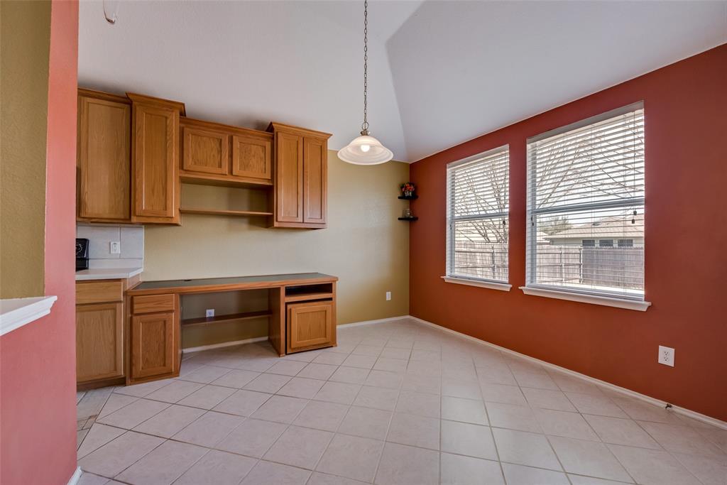 315 Red Oak Court Forney, TX 75126 - Photo 10 of 15 a kitchen with stainless steel appliances granite countertop a stove a sink and a microwave